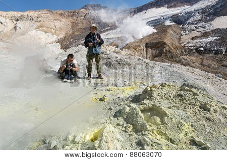 Photographers In Crater Of Active Mutnovsky Volcano. Kamchatka