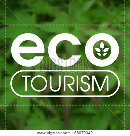 Ecotourism label against blurred green leafy background.