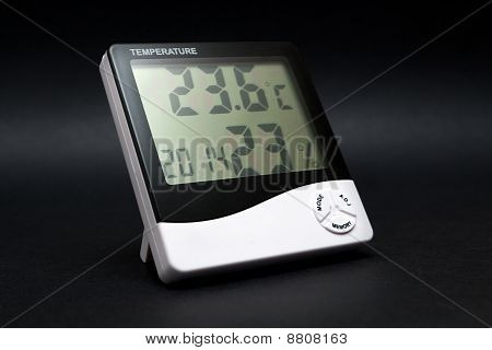 Black And White Thermometer On Black Background.