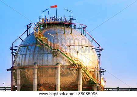Natural Petrochemical Gas Storage Tank In Heavy Petroleum Industry Estate Against Clear Blue Sky Bac