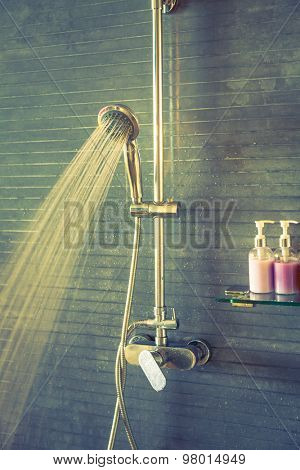 Shower while running water ( Filtered image processed vintage effect. )