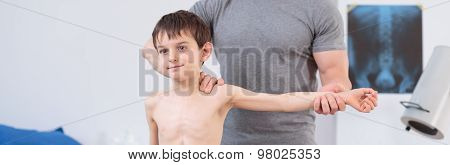 Little Child Exercising With Therapist