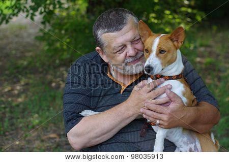 Bearded senior man with his cute dog
