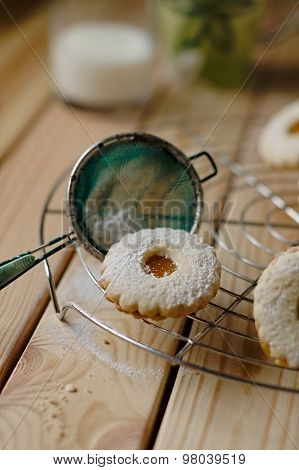 Linz Biscuit With Peach Marmalade With A Glass Of Milk In The Background