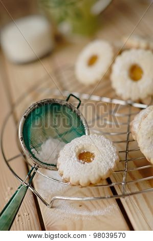 Linz Biscuit With Peach Marmalade With A Glass Of Milk In The Background