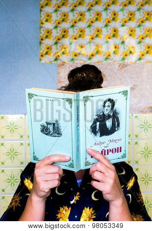 GOMEL, BELARUS - AUGUST 2, 2015: Girl holding a book by Andre Morua 