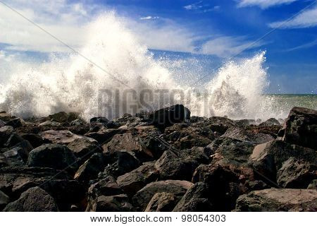 ocean waves crashing on a shore