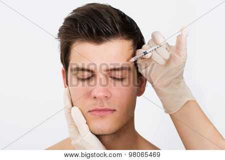 Person Hands Injecting Syringe With Botox