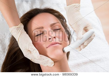 Woman Receiving Microdermabrasion Therapy