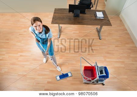 Janitor Mopping Floor In Office