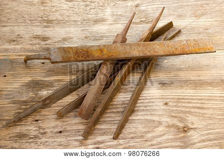 Various Different Steel Retro Rusty Rasp File Tool Collection Isolated On Wooden Background