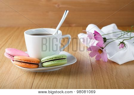 Coffe Cup With Three Colorful French Macaron