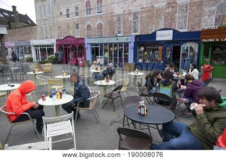 London United Kingdom 6 may 2017: people sit and eat at outside tables on outdoor cafe at The Warf in London on southbank of thames