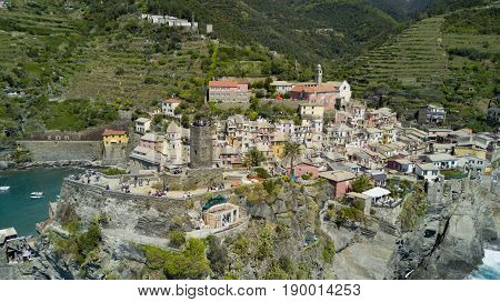 Aerial footage with drone on Vernazza, one of the famous Cinqueterre country, small village with colored houses on the cliff over the sea