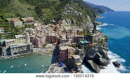 Aerial footage with drone on Vernazza, one of the famous Cinqueterre country, small village with colored houses on the cliff over the sea