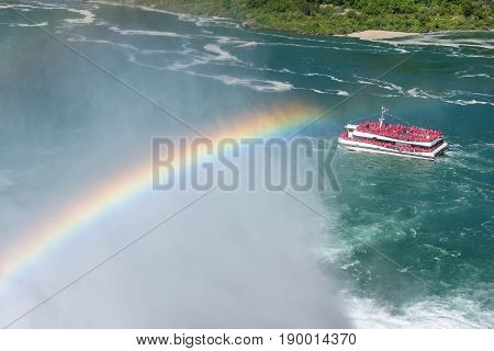 Rainbow at Niagara Falls and cruse ship, Ontario, Canada
