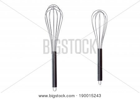 two different egg whisks isolated on whiote background