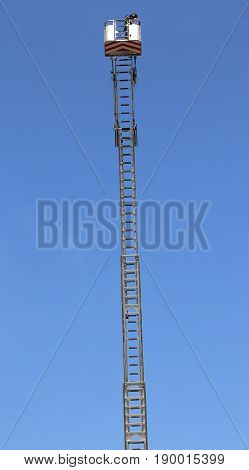 Basket With Aerial Platform Over The Very Long Special Ladder