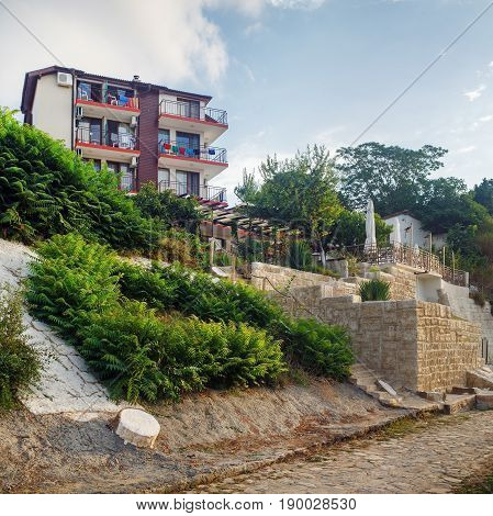 Nesebar Bulgaria - September 05 2014: Architecture and cobbled stone pavement in Old town Nesebar. Seaside resort Nessebar. Bulgarian Black Sea Coast. Architectural and Historic Complex. UNESCO world heritage site.