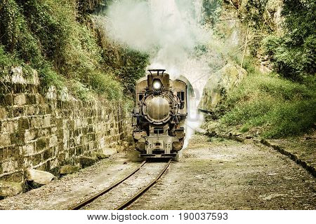 Steam narrow-gauge train moves from Yuejin to Bagou through the tunnel. Jiayang Mining Region. Sichuan province. China.