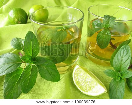 Glass of homemade ice tea with lemon mint