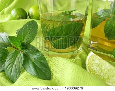 Glass of homemade ice tea with lemon mint
