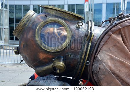 MONTREAL QUEBEC CANADA 19 05 17: The giant deep-sea diver sleeping in the street of Montreal for the 375e anniversary of the city, by Royal De Luxe company Nantes Franc