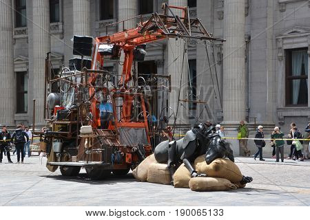 MONTREAL QUEBEC CANADA 19 05 17: The little giant girl sleeping in Place d'arme in old Montreal for the 375e anniversary of the city, by Royal De Luxe company Nantes France