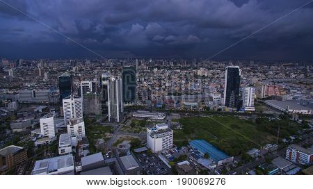 BANGKOK THAILAND - JUNE 72017 : aerial view of high and modern office building at ratchadaphisek road and rainstroming cloud background