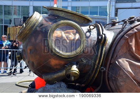 MONTREAL QUEBEC CANADA 19 05 17: The giant deep-sea diver sleeping in the street of Montreal for the 375e anniversary of the city, by Royal De Luxe company Nantes Franc