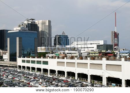 BANGKOK, THAILAND - JUNE 3, 2017 : parking lot and skyline next to Chatuchak Market.