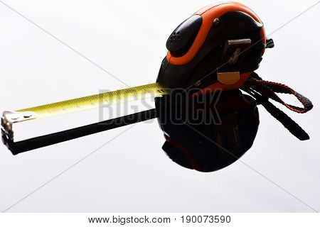 Ruler With Self Retracting Mechanism And Its Reflection