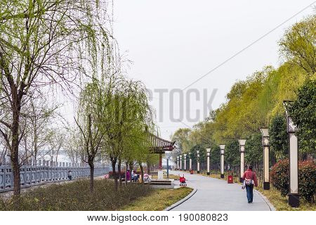 Tourists On Embankment Of Yi River On East Hill