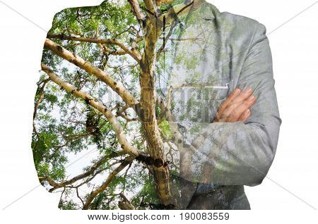 Double Exposure of Businessman with Green Tree Branch Trunk as Eco-friendly or Environmen Conserving Concept.