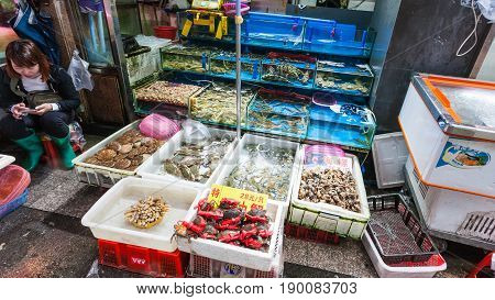 Seller Near Stall In Fish Market In Guangzhou City