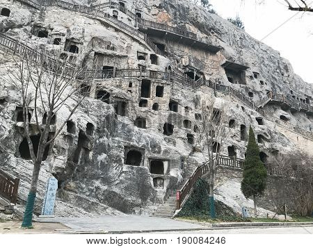 Carved Caves And Houses In Longmen Grottoes