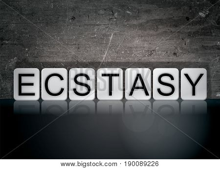 The word Ecstasy concept and theme written in 3D white tiles on a dark background.