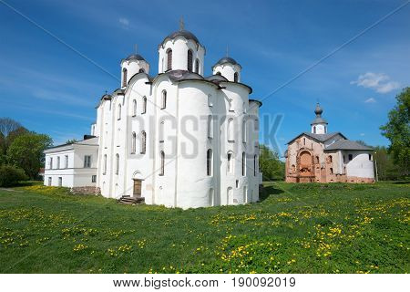 View of St. Nicholas Cathedral and church off Paraskev Fridays in the sunny May afternoon. Veliky Novgorod. Russia