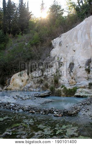BAGNI SAN FILIPPO, ITALY - JUNE 2 2017: Fosso Bianco rock formation in Tuscany Italy hot spring area in Val D'Orcia region