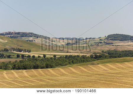 VAL D'ORCIA, ITALY - JUNE 3 2017: Hills surrounding Val D'orcia area in Tuscany region of Italy
