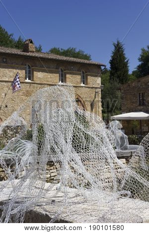 BAGNO VIGNONI, ITALY - JUNE 3 2017: Metal Wires transparent sculpture by Italian sculptress Daniela Capaccioli in Bagno Vignoni medieval town in Tuscany Italy