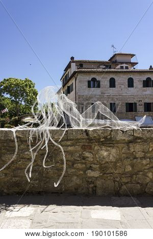 BAGNO VIGNONI, ITALY - JUNE 3 2017: Metal Wires transparent sculpture by Italian sculptress Daniela Capaccioli in Bagno Vignoni medieval town in Tuscany Italy