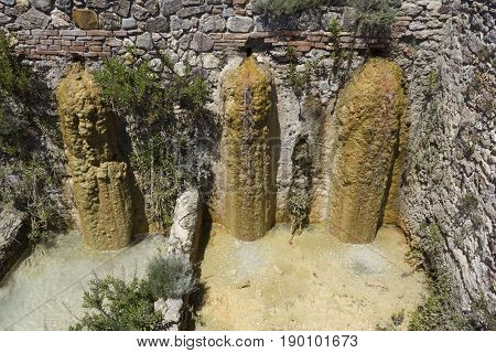 BAGNO VIGNONI, ITALY - JUNE 3 2017: Old thermal baths of Bagno Vignoni in Tuscany Italy free accesible hot spring site