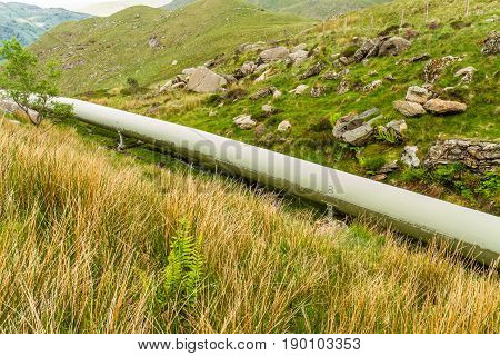 Water pipe from lake Llyn Llydaw on Snowdon to Cwm Dyli hydroelectric power station. Snowdonia Wales United Kingdom.