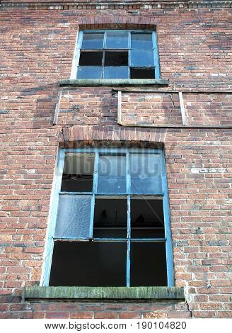 broken windows un an abandoned derelict brick building