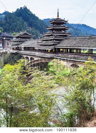 Covered Chengyang Wind And Rain Bridge Over River