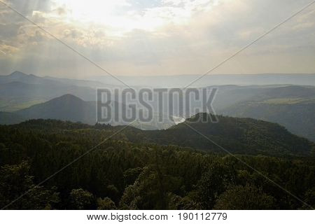 Archive photo from august 2012 with view from metal lookout tower named Varhost to valley of european river Labe in czech republic