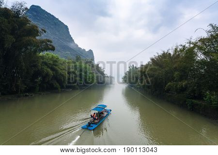 Chinese Ship On River Near Peaks Near Xingping