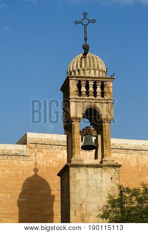 Monastery bell Mardin Province Turkey and shadow