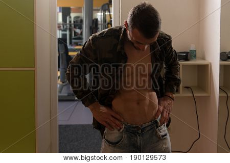 Fit Man In Locker Room Changes Clothings